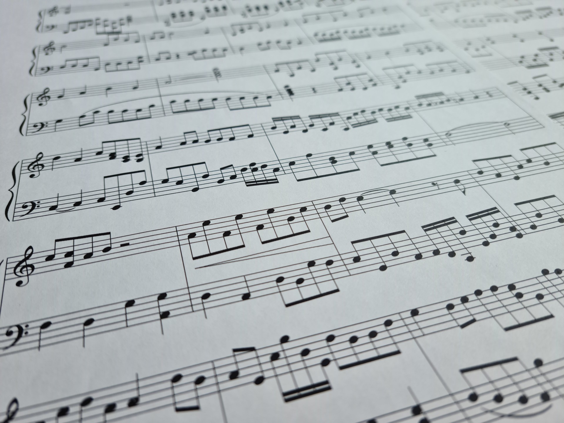 White paper with musical notes closeup background